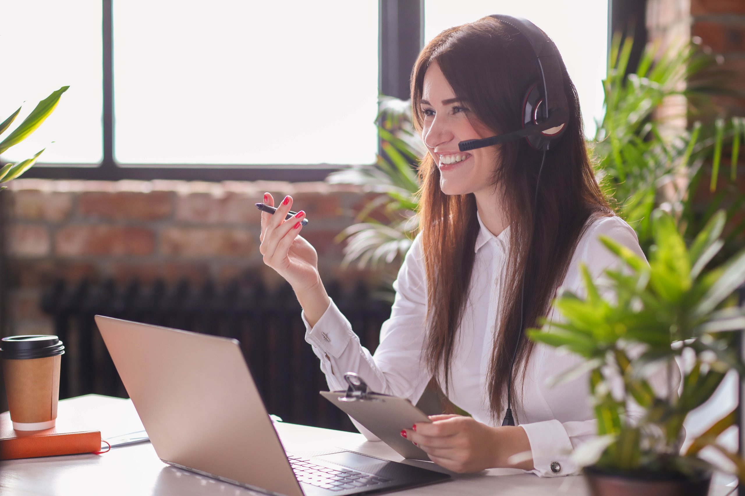 Female with headsets working at customer service